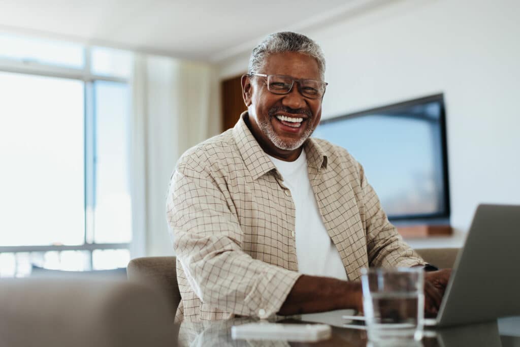 Older man using a laptop computer